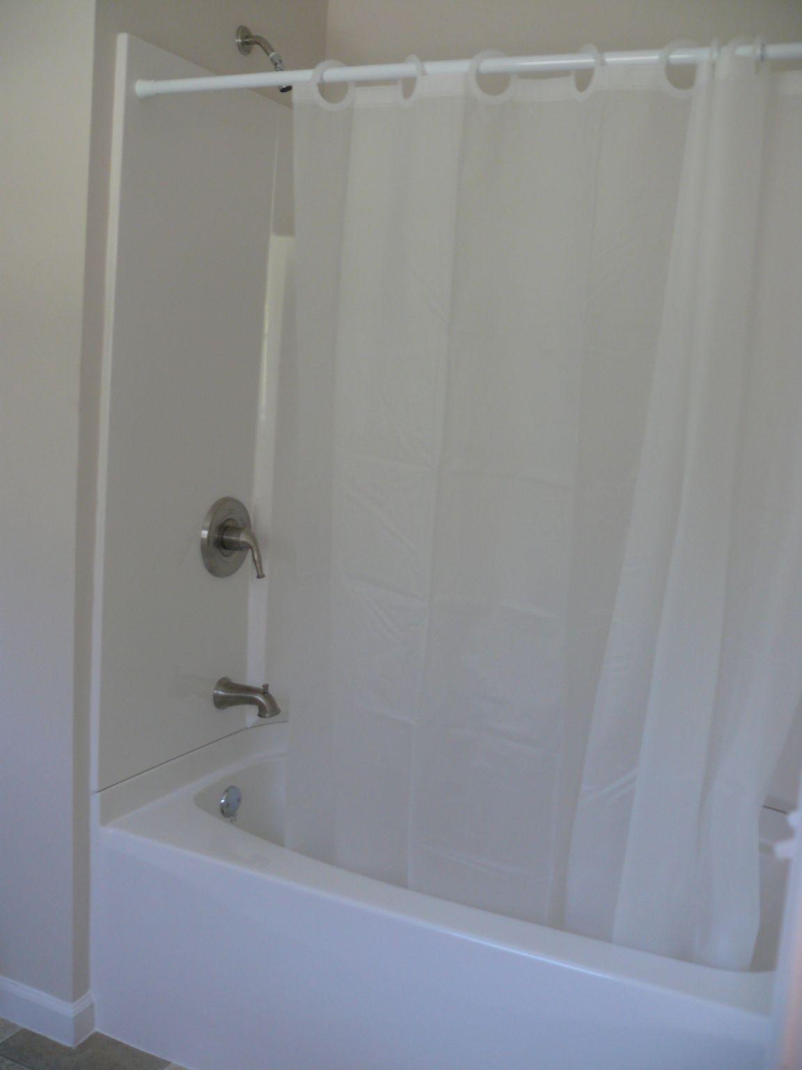 409 Republican Church Road Ferrum, VA 24088 - Photo 18 of 28 a bathroom with a shower and a bath tub