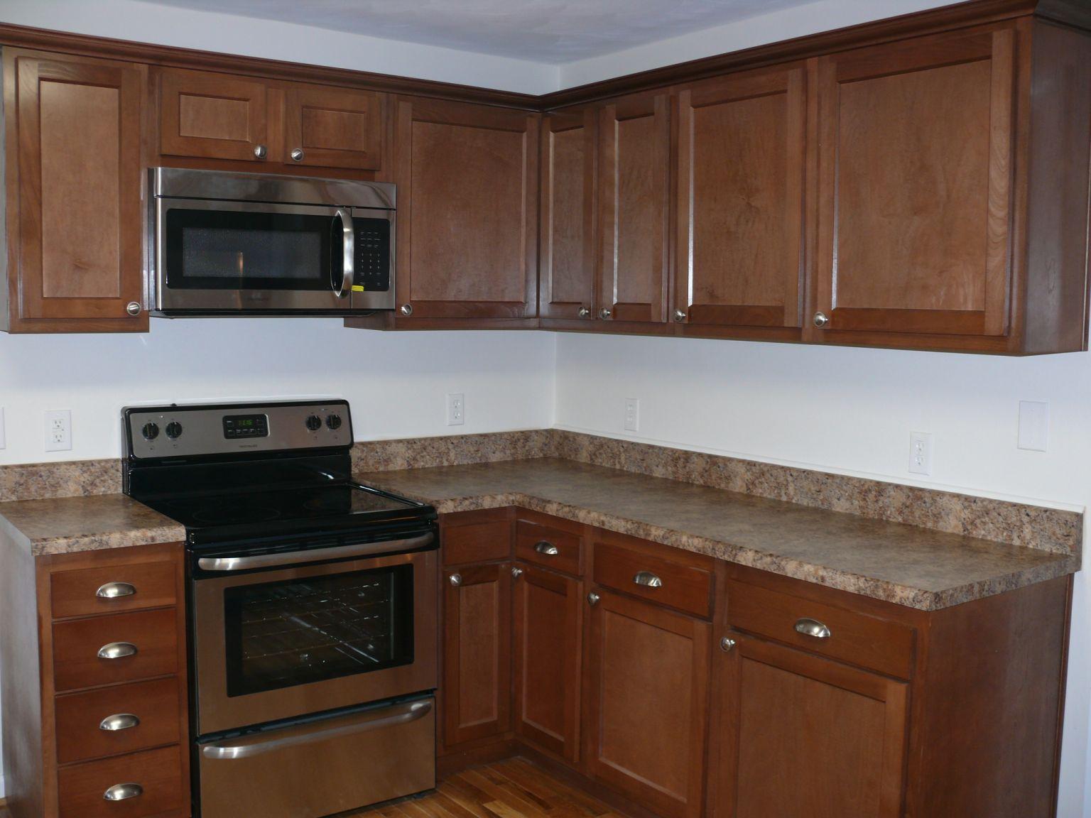 409 Republican Church Road Ferrum, VA 24088 - Photo 3 of 28 a kitchen with granite countertop wood cabinets and stainless steel appliances