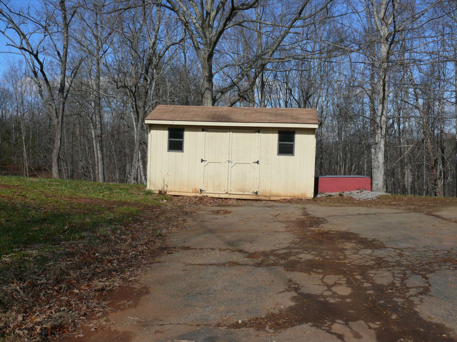409 Republican Church Road Ferrum, VA 24088 - Photo 22 of 28 a house with trees in front of it