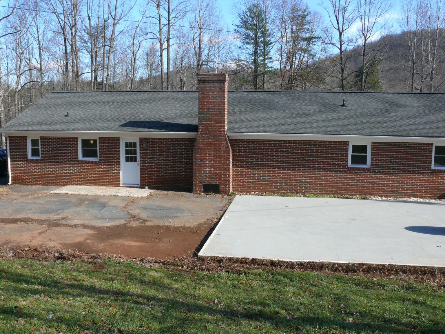 409 Republican Church Road Ferrum, VA 24088 - Photo 23 of 28 a backyard of a house with lots of green space