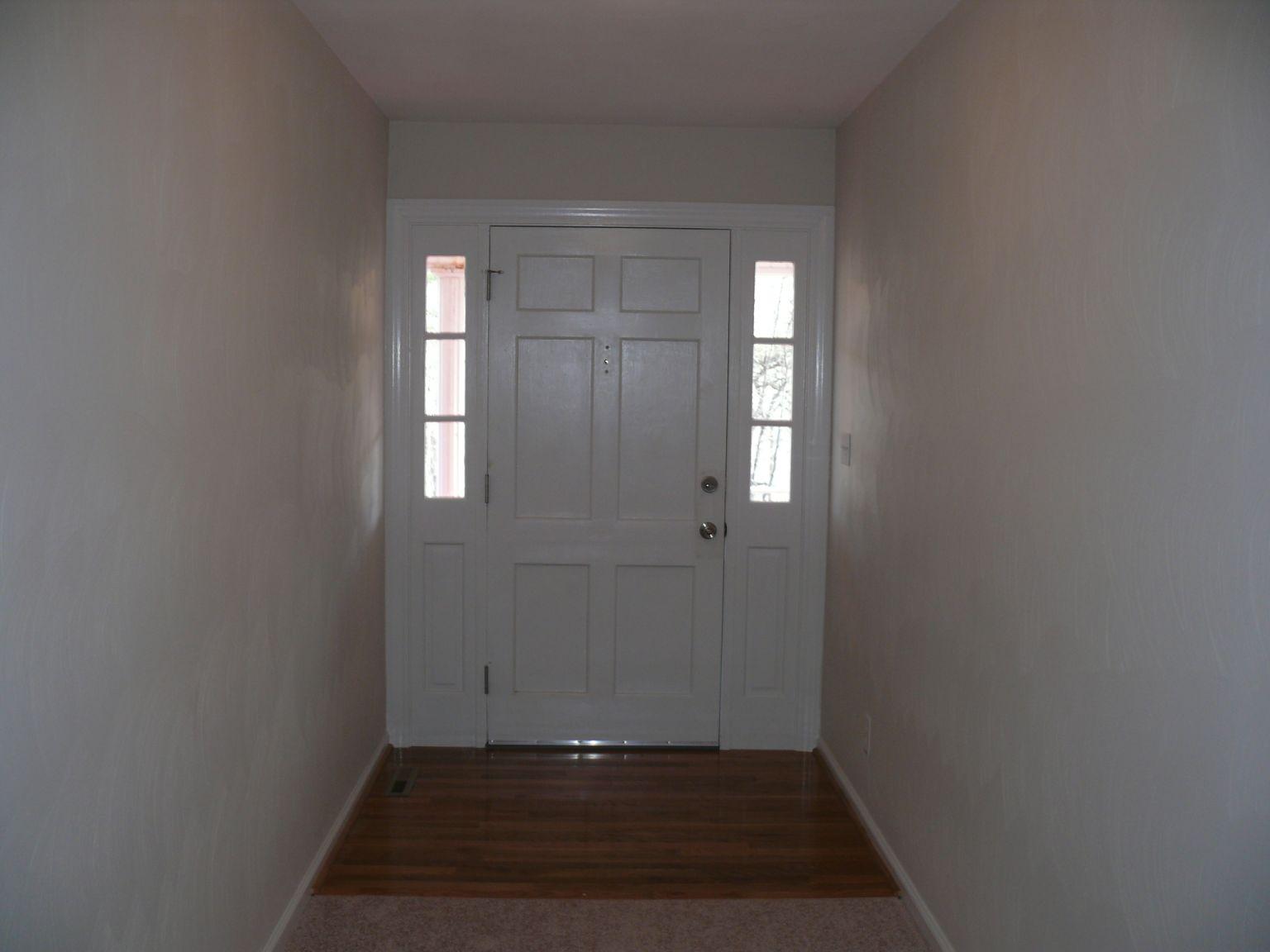 409 Republican Church Road Ferrum, VA 24088 - Photo 5 of 28 a view of an empty room with wooden floor and a window