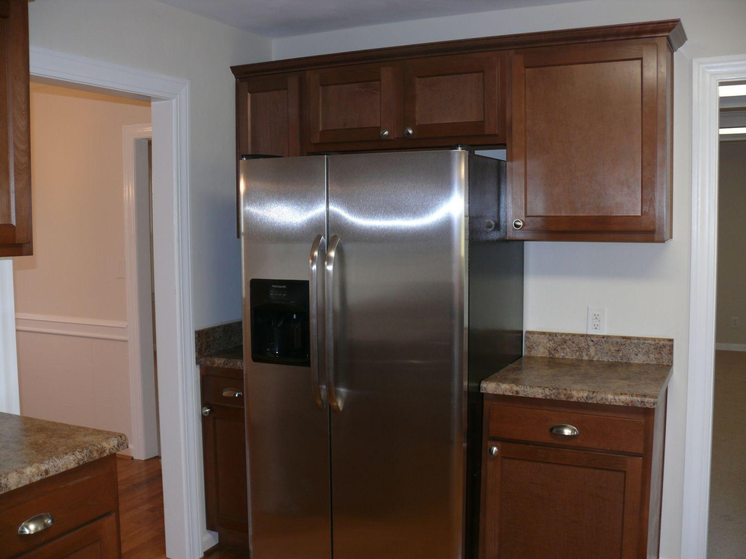 409 Republican Church Road Ferrum, VA 24088 - Photo 8 of 28 a kitchen with a refrigerator and cabinets