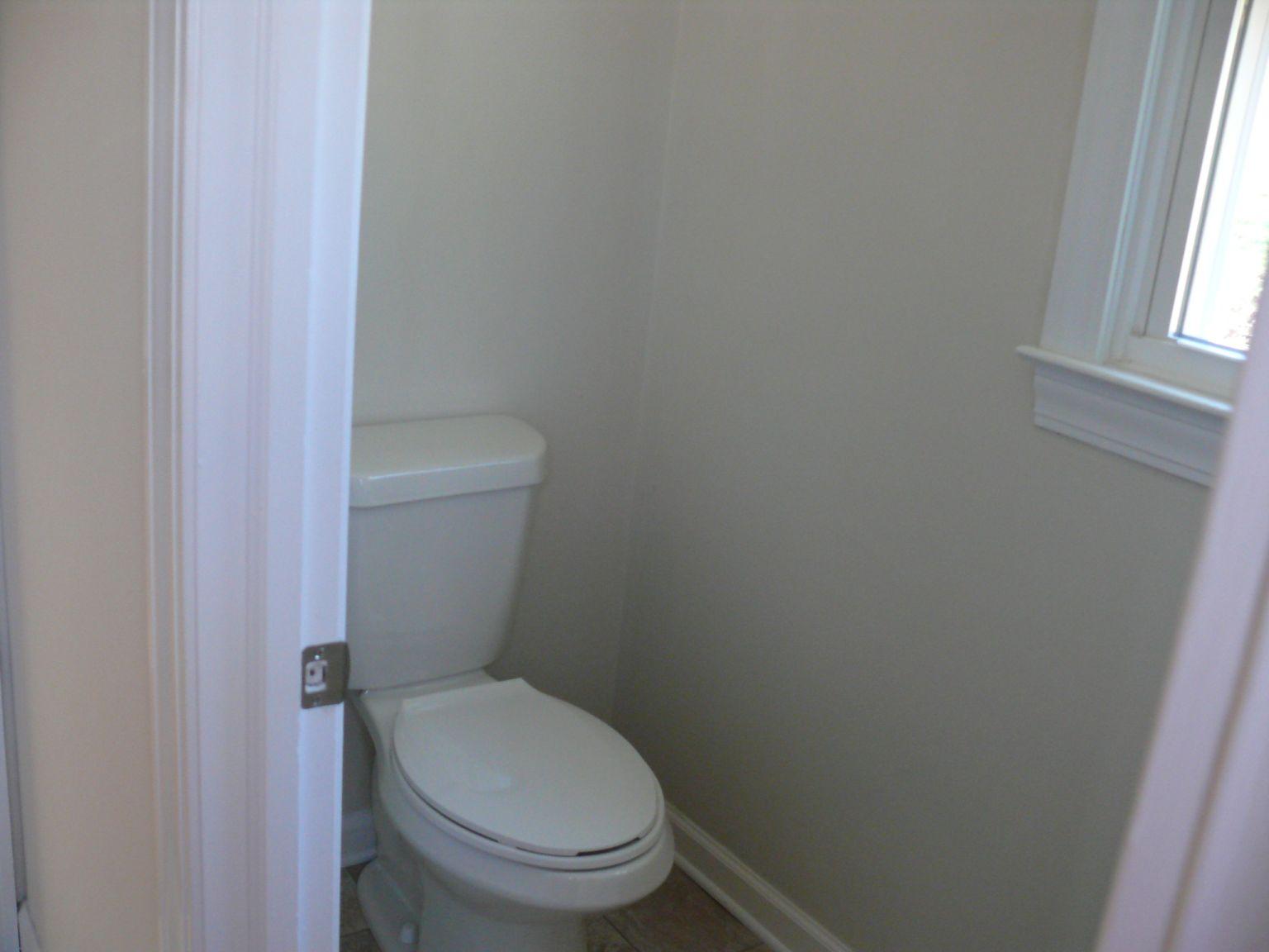 409 Republican Church Road Ferrum, VA 24088 - Photo 10 of 28 a white toilet sitting next to a window