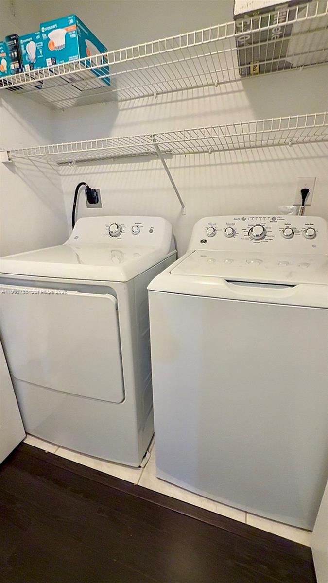 6831 Southwest 44th Street, Unit 302 Miami, FL 33155 - Photo 12 of 28 a utility room with dryer and washer