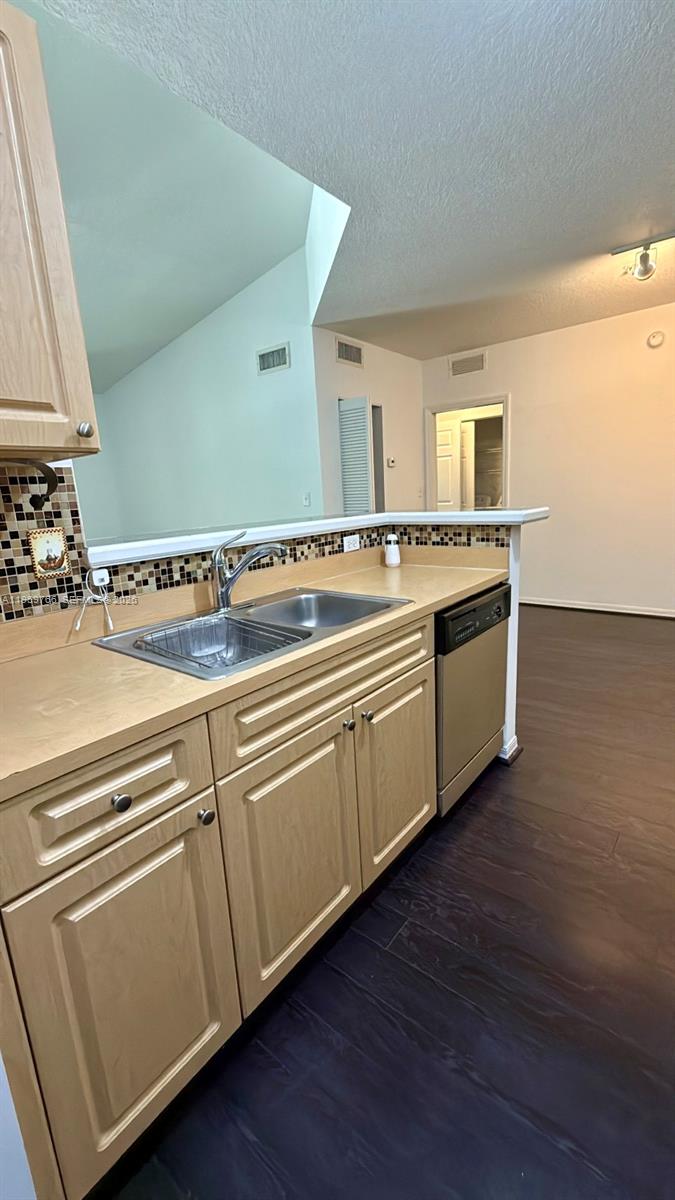 6831 Southwest 44th Street, Unit 302 Miami, FL 33155 - Photo 3 of 28 a view of a kitchen with wooden floor and electronic appliances