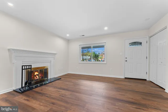 a kitchen with stainless steel appliances white cabinets and a sink