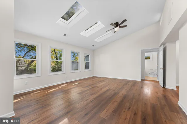 a view of a hallway with washer and dryer