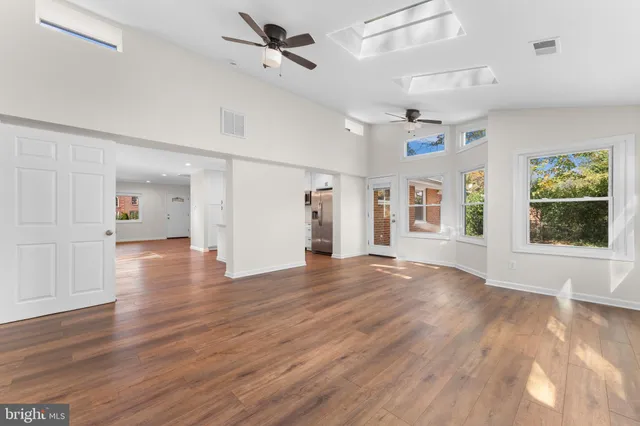 a bathroom with a sink a mirror a toilet and a bathtub