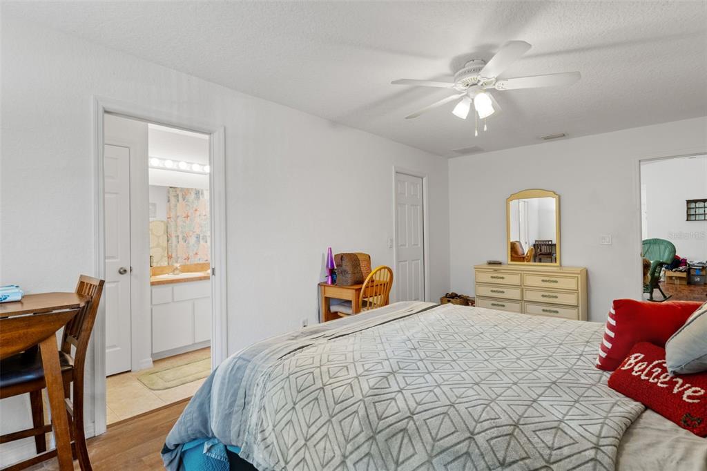 3493 East Odier Street Inverness, FL 34453 - Photo 15 of 24 a bedroom with a bed and wooden floor