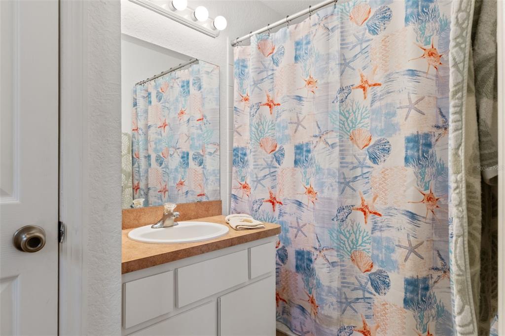 3493 East Odier Street Inverness, FL 34453 - Photo 16 of 24 a bathroom with a sink and a mirror