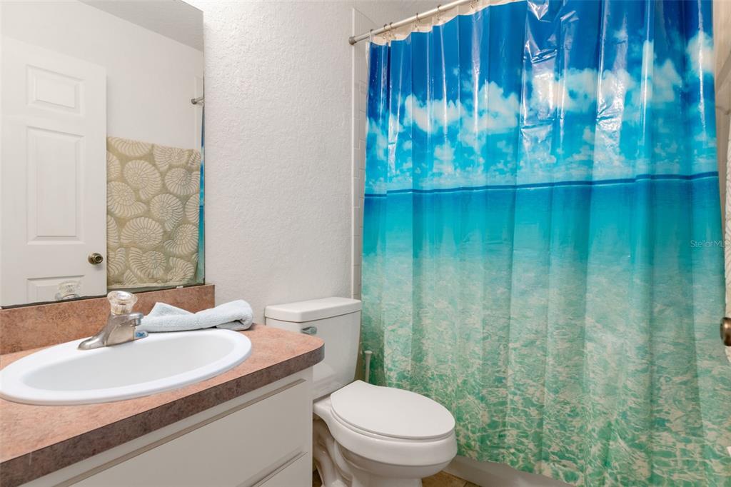 3493 East Odier Street Inverness, FL 34453 - Photo 19 of 24 a bathroom with a sink a toilet and a mirror