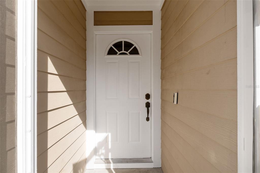 3493 East Odier Street Inverness, FL 34453 - Photo 4 of 24 a view of a hallway with wooden floor and entryway