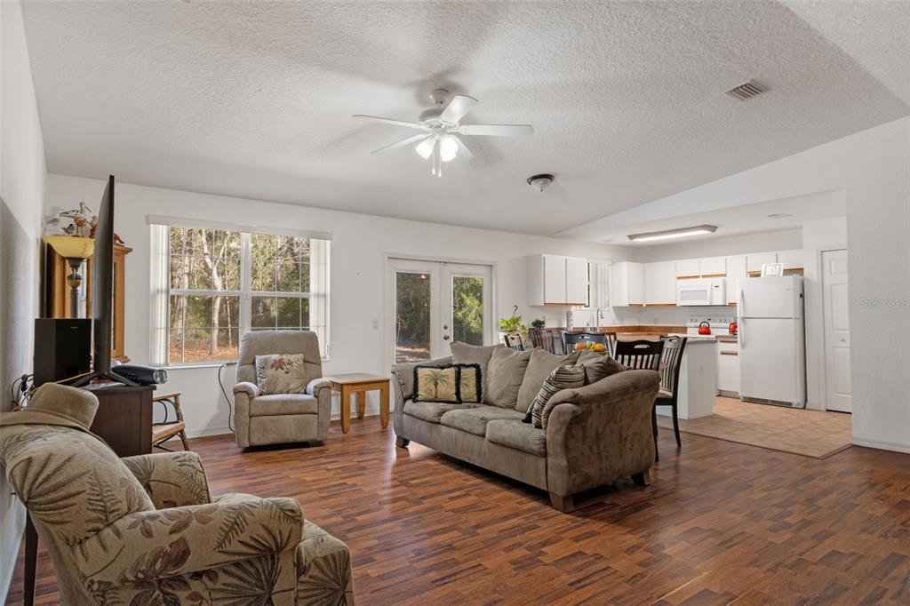 3493 East Odier Street Inverness, FL 34453 - Photo 6 of 24 a living room with furniture and a large window