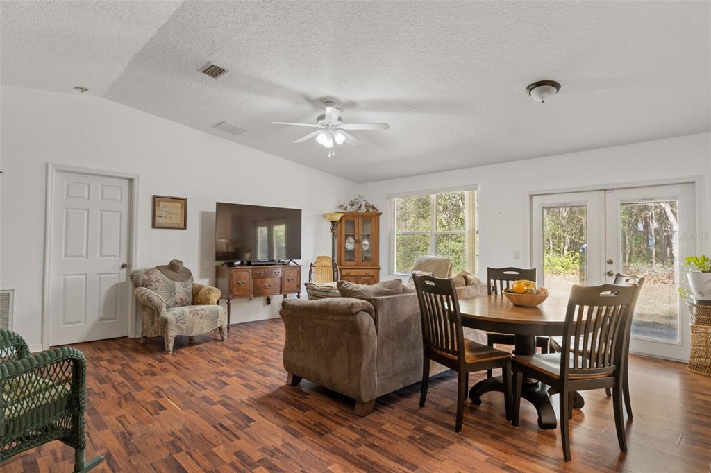 3493 East Odier Street Inverness, FL 34453 - Photo 8 of 24 a view of a dining room with furniture window and wooden floor