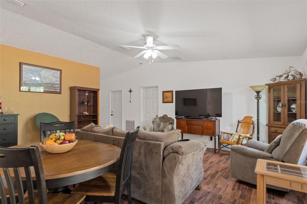 3493 East Odier Street Inverness, FL 34453 - Photo 9 of 24 a living room with furniture and a flat screen tv