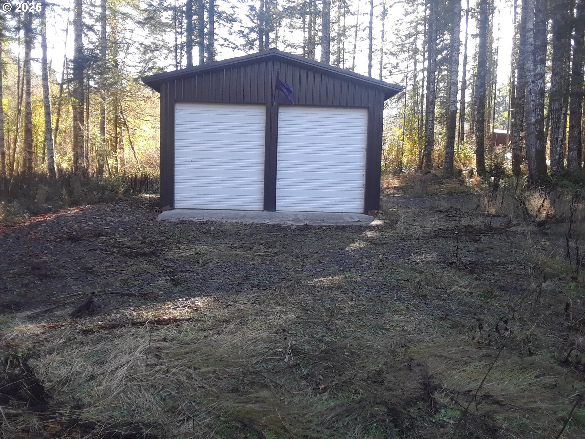 7310 Alvord Alley Grand Ronde, OR 97347 - Photo 2 of 2 a view of house with backyard and trees