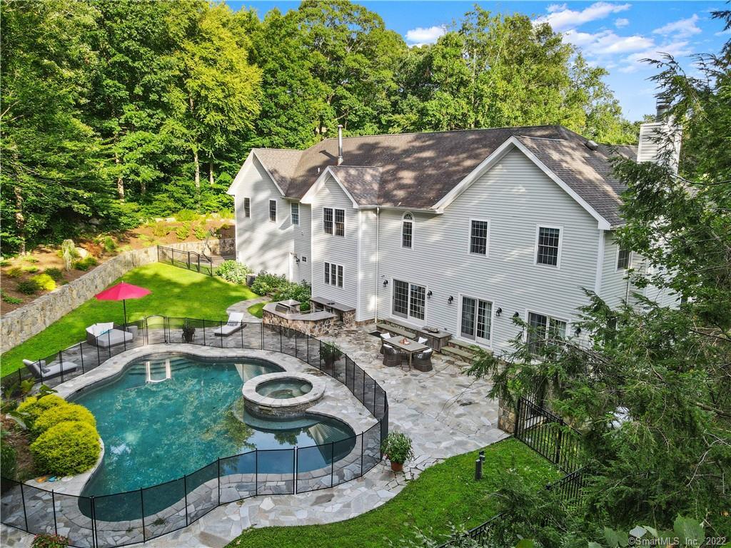 a house view with a seating space and garden