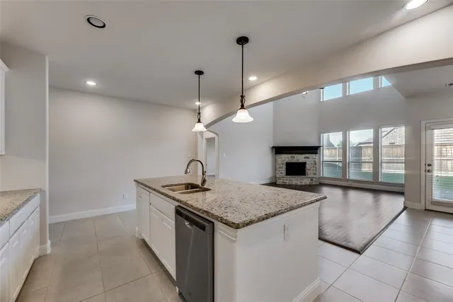 a kitchen with a sink a counter space and a stove