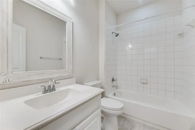 a bathroom with a sink a toilet and a bathtub