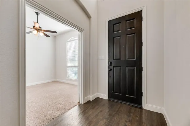 an empty room with wooden floor
