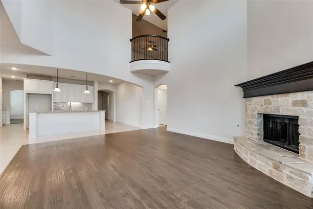 a view of a kitchen with a sink and a fireplace