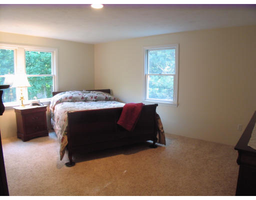 238 Cordaville Road Ashland, MA 01721 - Photo 7 of 13 a bedroom with a bed and a window
