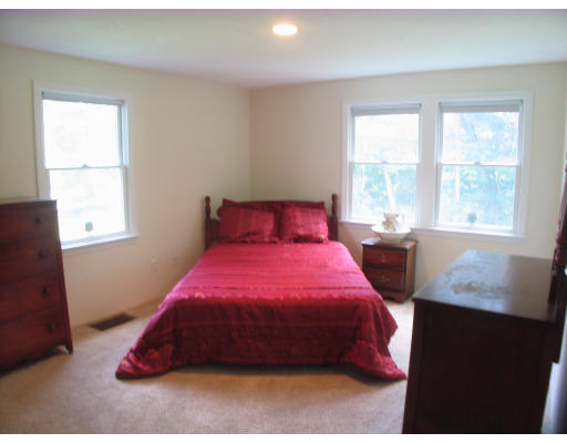 238 Cordaville Road Ashland, MA 01721 - Photo 9 of 13 a bedroom with a bed and a window
