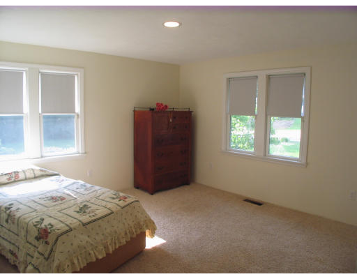 238 Cordaville Road Ashland, MA 01721 - Photo 10 of 13 a bedroom with a bed and a window