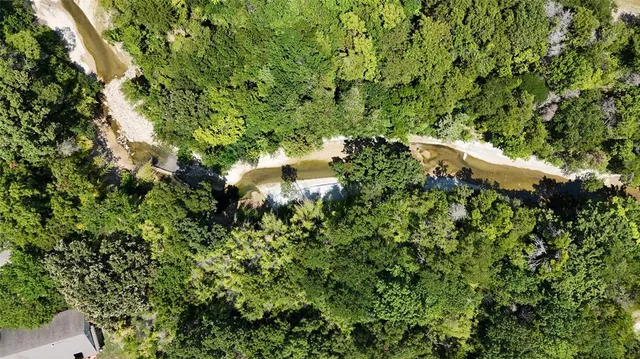 a view of a house in a forest