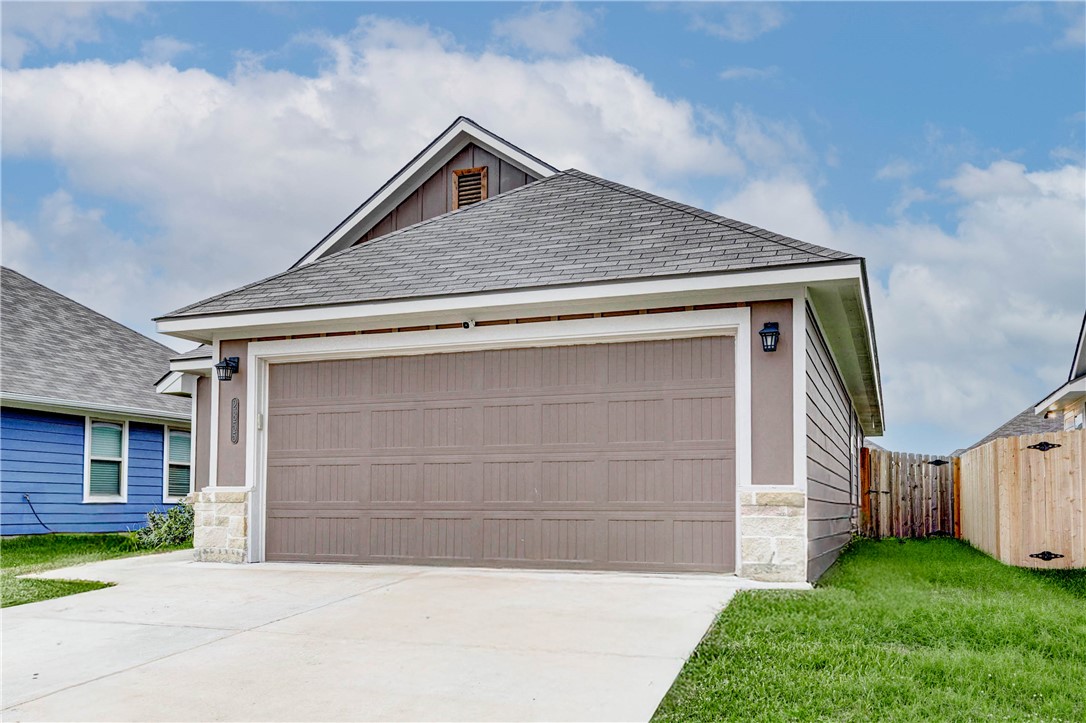 2855 Messenger Way Bryan, TX 77803 - Photo 3 of 16 a front view of a house with a yard and garage