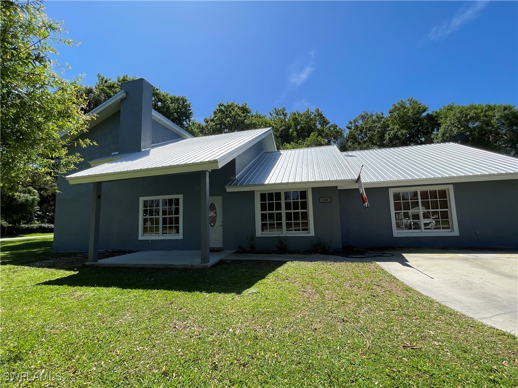 front view of a house with a yard