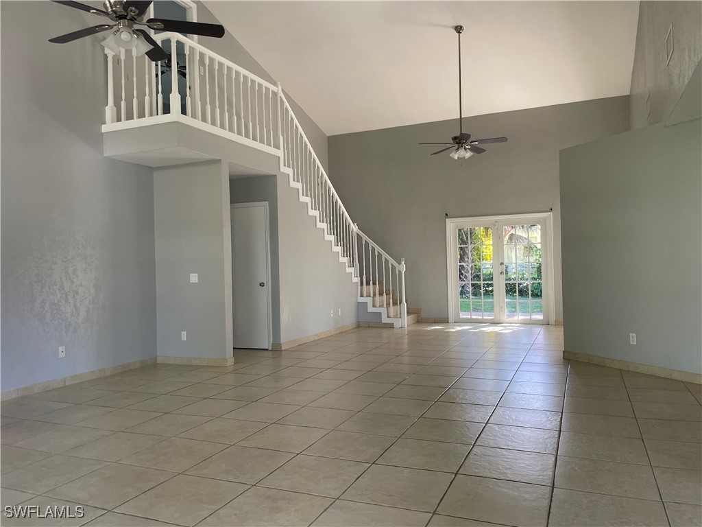 200 Ridgewood Avenue Clewiston, FL 33440 - Photo 19 of 50 a view of entryway and hall with a chandelier