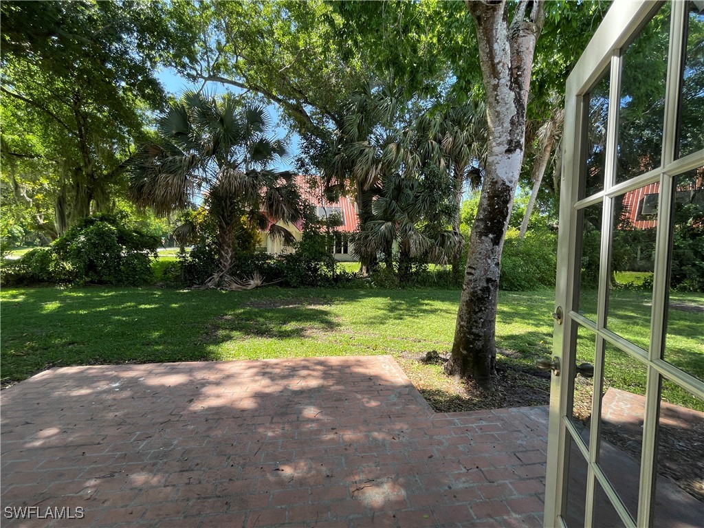 200 Ridgewood Avenue Clewiston, FL 33440 - Photo 22 of 50 a view of outdoor space with garden