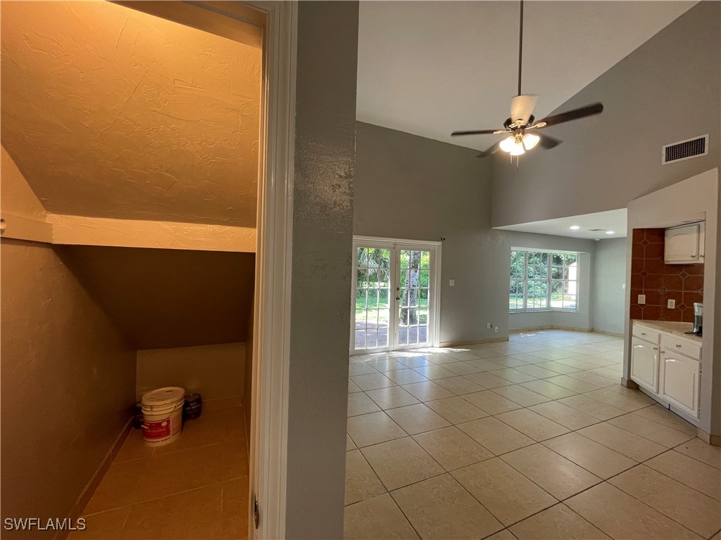 200 Ridgewood Avenue Clewiston, FL 33440 - Photo 32 of 50 a view of livingroom with hardwood floor and ceiling fan