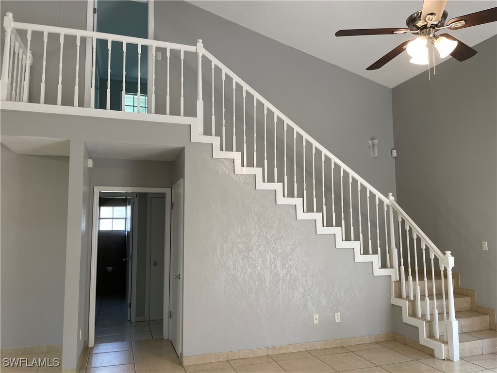 200 Ridgewood Avenue Clewiston, FL 33440 - Photo 40 of 50 a view of staircase with railing and a chandelier