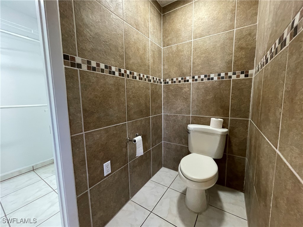 200 Ridgewood Avenue Clewiston, FL 33440 - Photo 46 of 50 a bathroom with a toilet and a shower