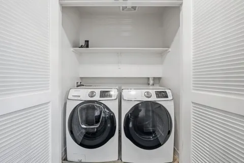 a utility room with dryer and washer