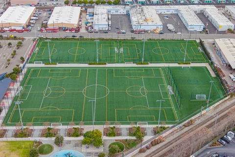a view of a pathway with a garden