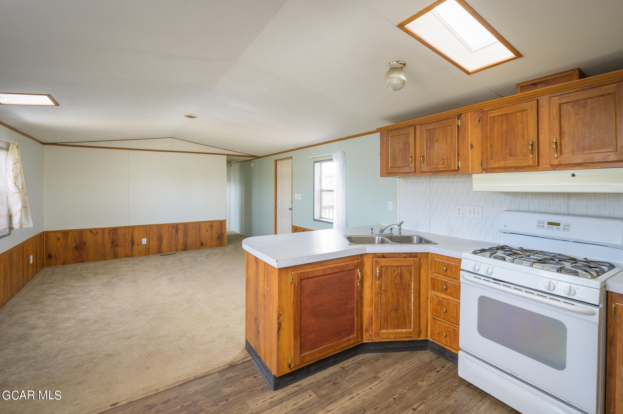430 Casa Drive Granby, CO 80446 - Photo 12 of 37 a kitchen with a stove and a sink
