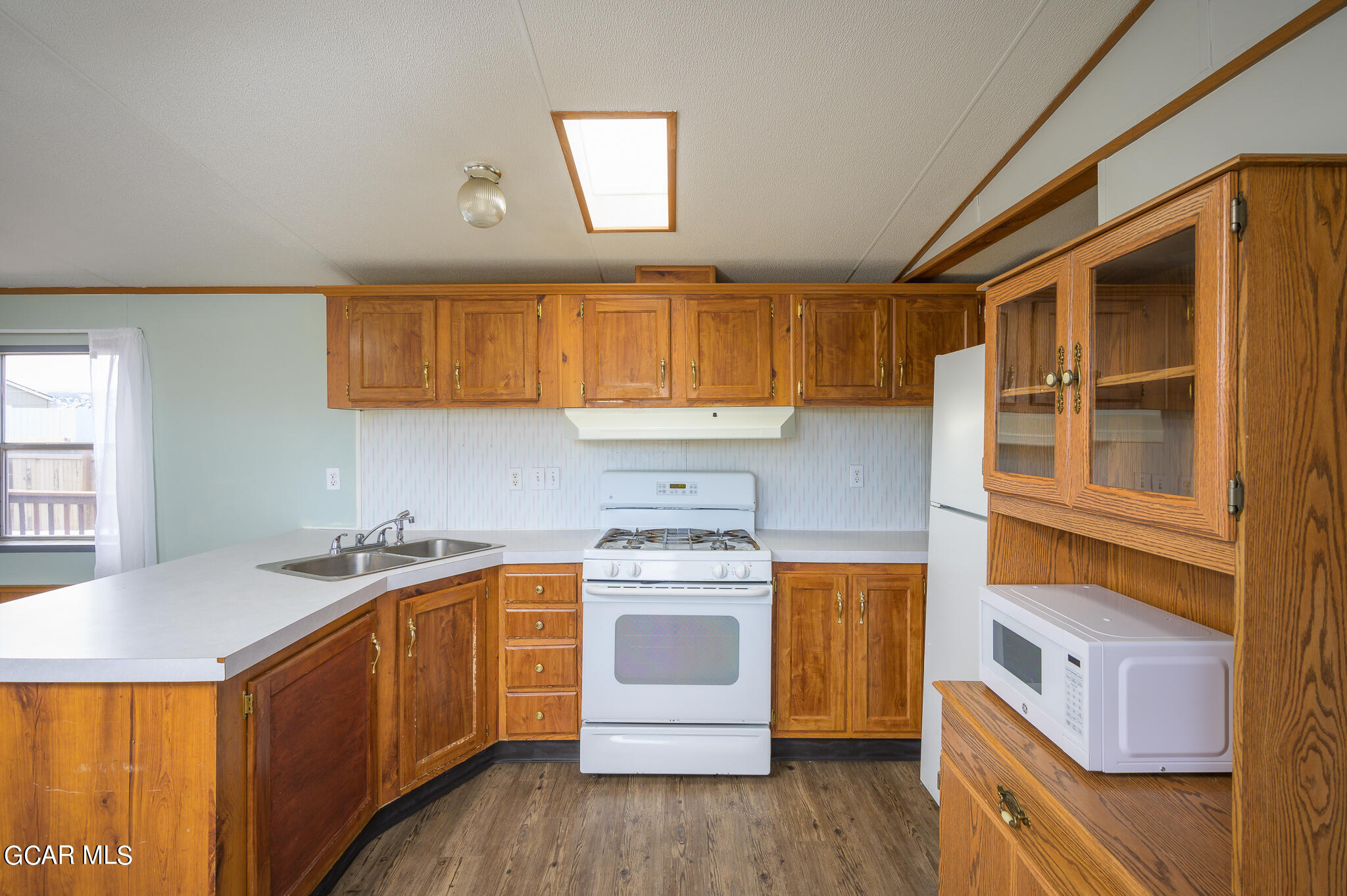 430 Casa Drive Granby, CO 80446 - Photo 13 of 37 a kitchen that has a sink and a stove
