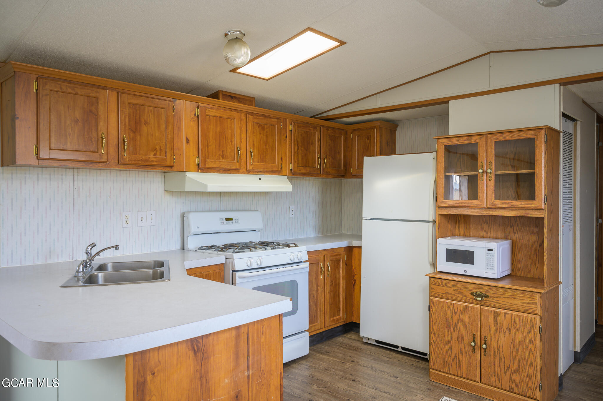 430 Casa Drive Granby, CO 80446 - Photo 14 of 37 a kitchen with stainless steel appliances granite countertop a sink a stove and a refrigerator
