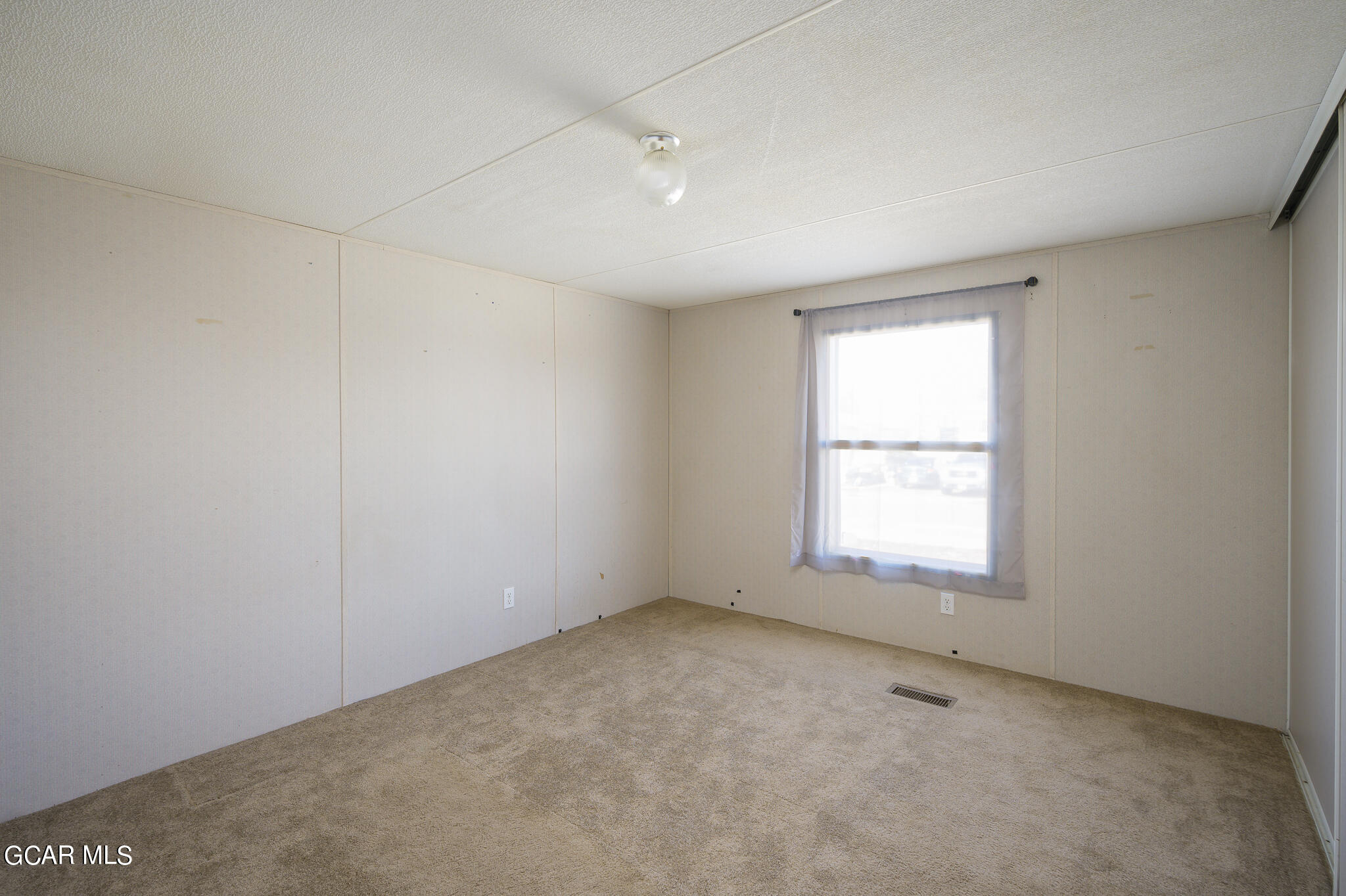 430 Casa Drive Granby, CO 80446 - Photo 19 of 37 an empty room with a window
