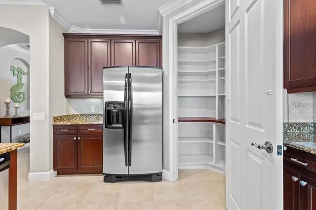 a kitchen with stainless steel appliances cabinets and a refrigerator