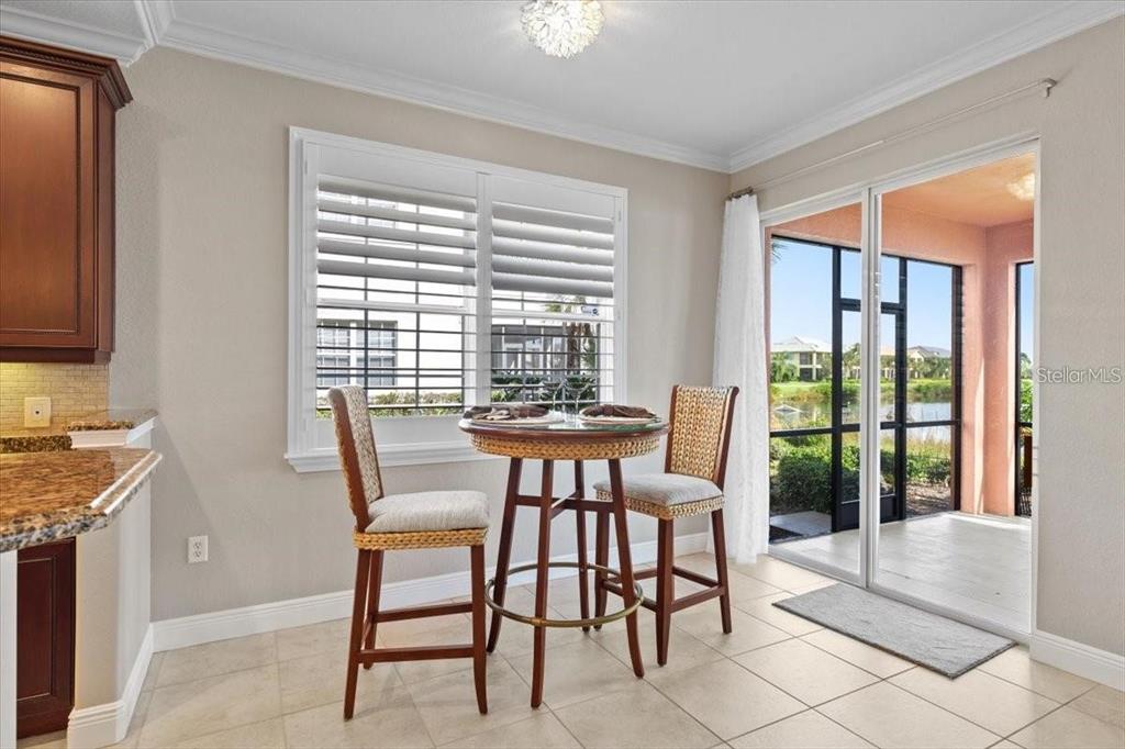 1143 Riverscape Street, Unit A Bradenton, FL 34208 - Photo 16 of 53 a view of a dining room with furniture window and outside view