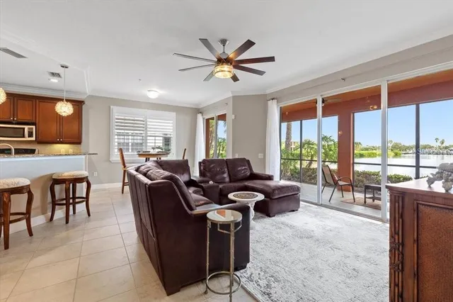 a living room with furniture a large window with outer view