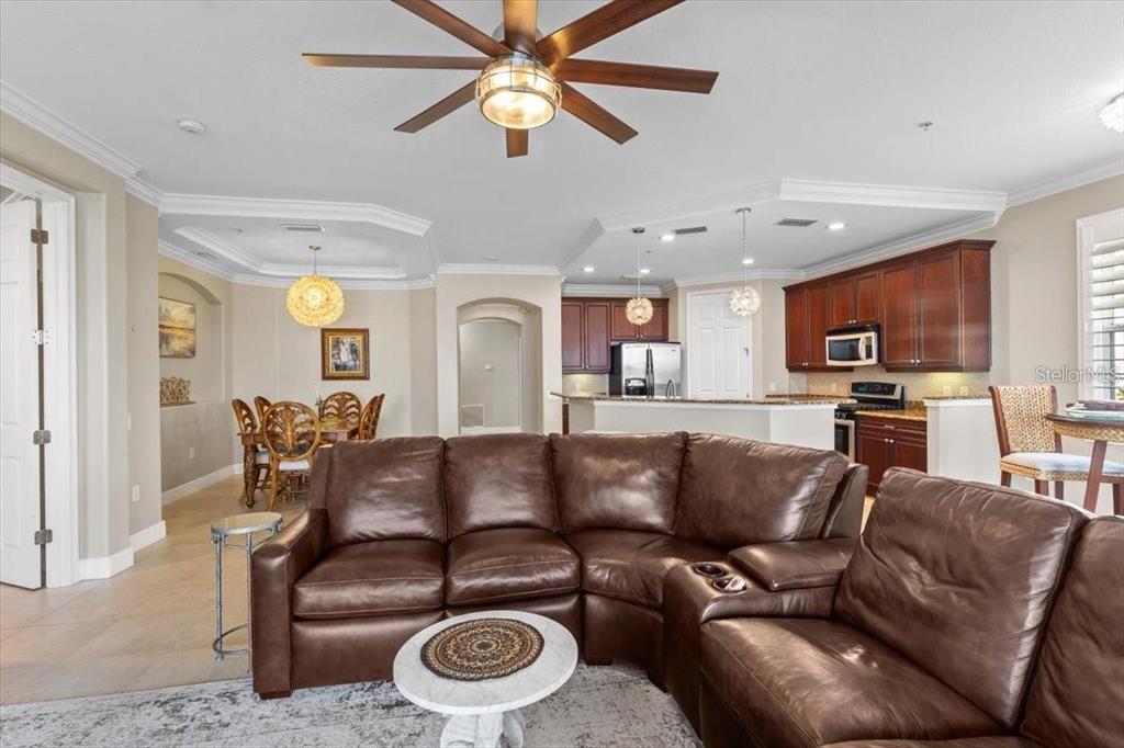 1143 Riverscape Street, Unit A Bradenton, FL 34208 - Photo 20 of 53 a living room with furniture and a view of kitchen