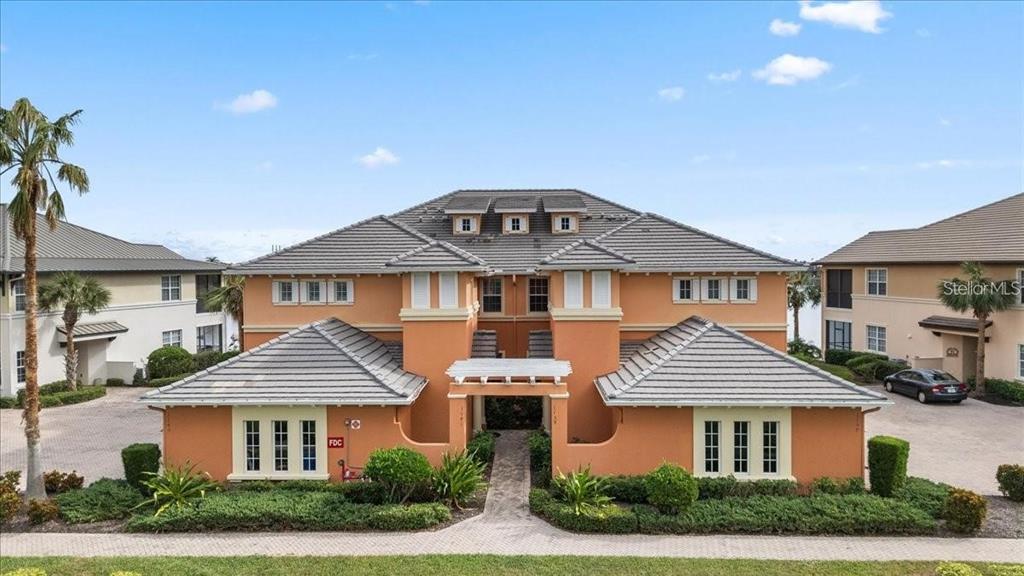1143 Riverscape Street, Unit A Bradenton, FL 34208 - Photo 2 of 53 a front view of a house with a yard