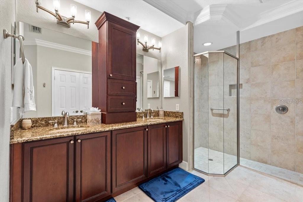1143 Riverscape Street, Unit A Bradenton, FL 34208 - Photo 28 of 53 a bathroom with a double vanity sink mirror and double