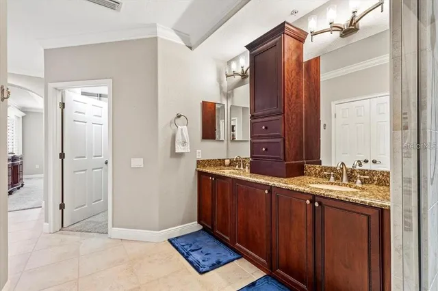 a view of a porch with furniture and floor to ceiling window