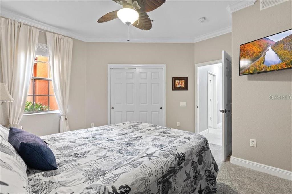 1143 Riverscape Street, Unit A Bradenton, FL 34208 - Photo 40 of 53 a bedroom with a bed and a painting on the wall